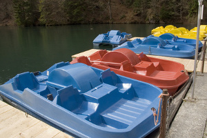 Blue, red, and yellow pedal boats