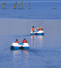 Cruising on a paddle boat across a lake